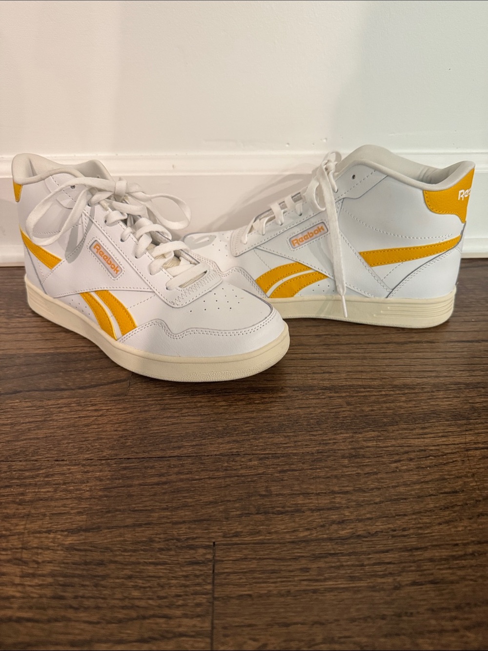 Reebok Women’s White High-Top Sneakers with Yellow Accents